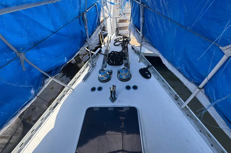 Slide: The Image of Deck of 1996 Blue Water 60 Ketch sailboat with blue tarps and winches. - 3