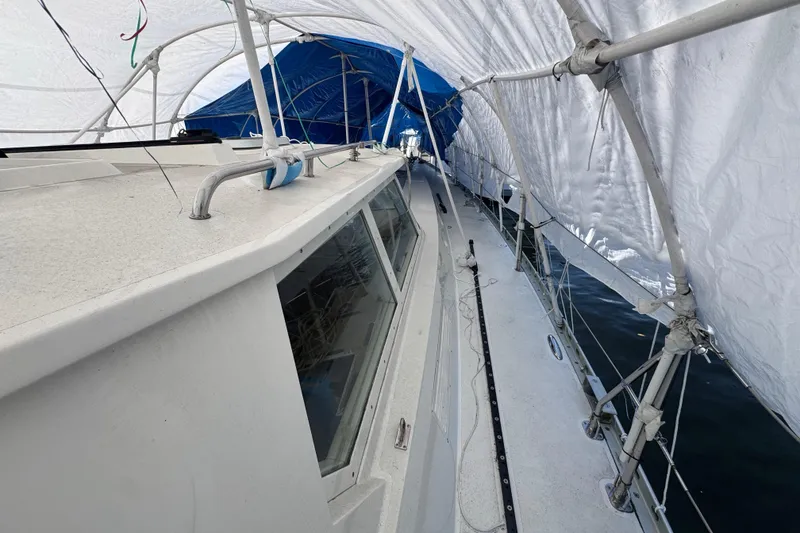 Slide: The Image of Covered deck of a 1996 Blue Water 60 Ketch sailboat, sheltered with tarps. - 6