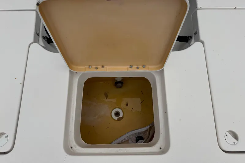 Slide: The Image of Open storage compartment on 2003 Maverick 18 Master Angler boat. - 13