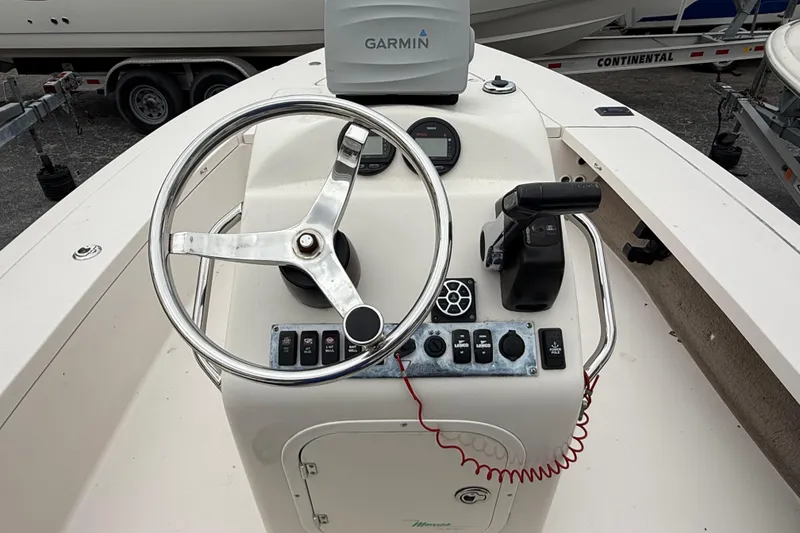 Slide: The Image of 2003 Maverick 18 Master Angler boat console with Garmin GPS and steering wheel. - 15