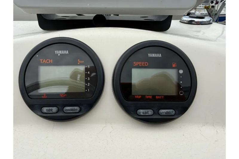 Slide: The Image of Yamaha tachometer and speedometer on 2003 Maverick 18 Master Angler boat dashboard. - 17