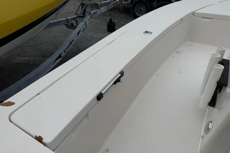 Slide: The Image of 2003 Maverick 18 Master Angler boat interior with rod holders and trailer. - 19