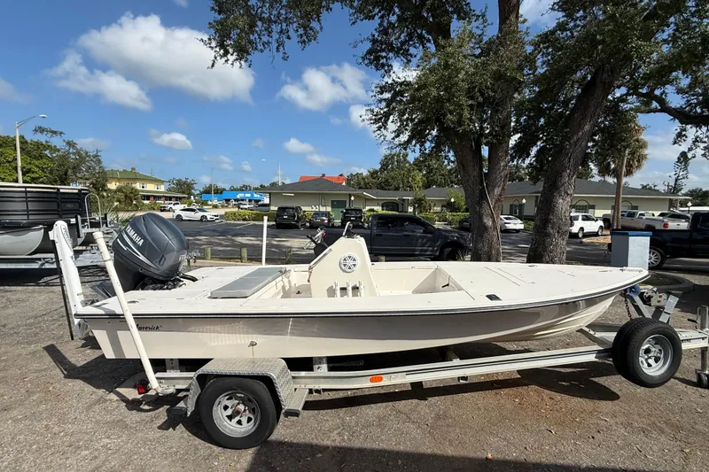 Slide: The Image of 2003 Maverick 18 Master Angler boat on trailer, parked outdoors under clear sky. - 2