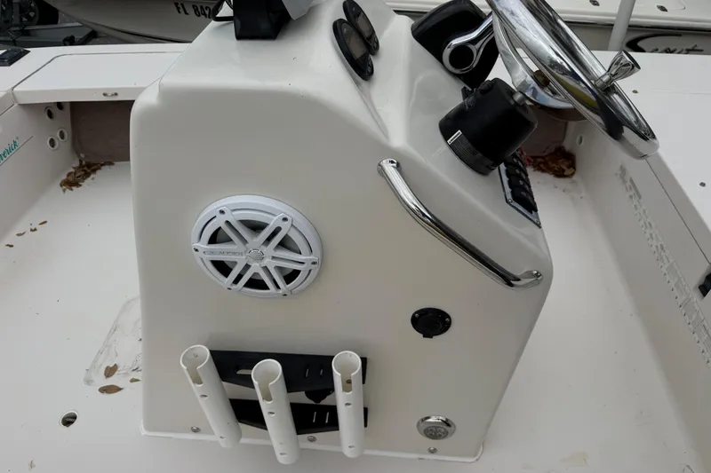 Slide: The Image of 2003 Maverick 18 Master Angler boat console with steering wheel and speaker. - 21