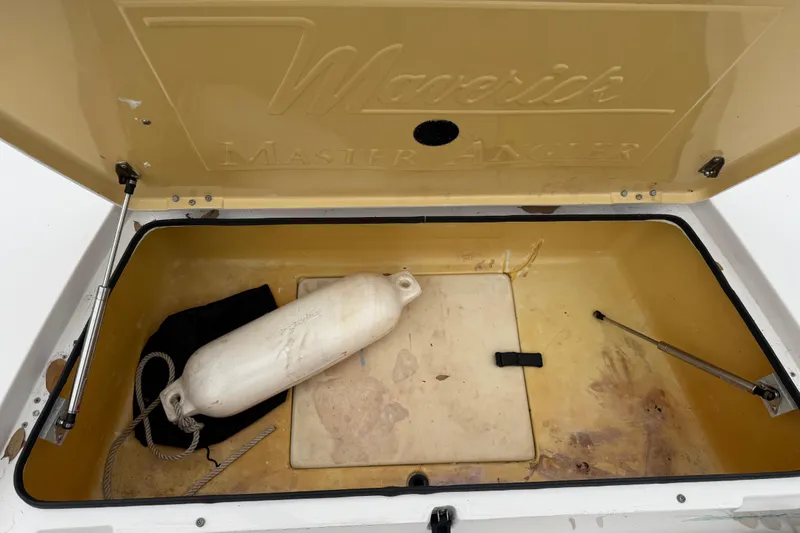 Slide: The Image of Open storage compartment of 2003 Maverick 18 Master Angler boat with fender and rope. - 23