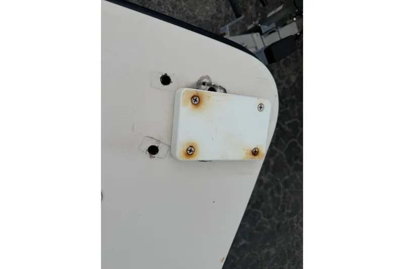 Slide: The Image of 2003 Maverick 18 Master Angler boat with rusted screws on a white plate. - 25