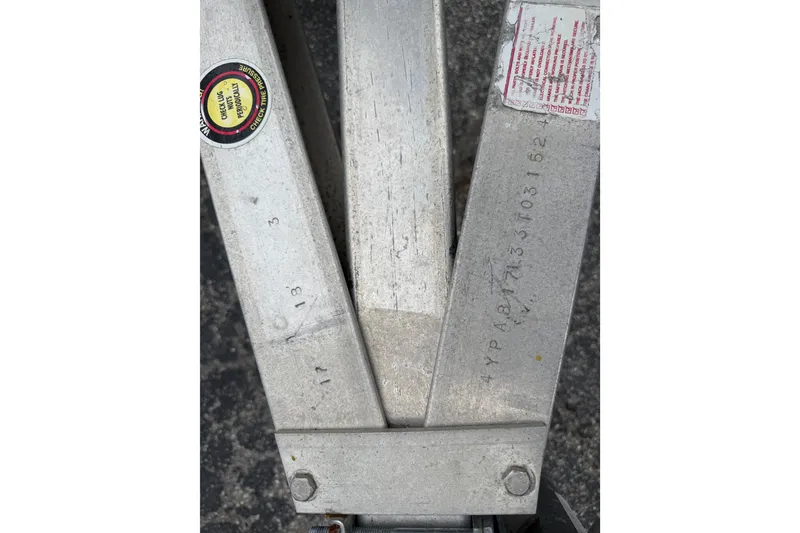 Slide: The Image of Close-up of a 2003 Maverick 18 Master Angler boat trailer with visible serial numbers. - 29