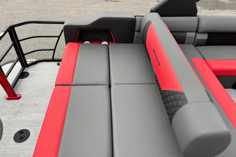 Slide: The Image of 2026 Berkshire 25SB2 STS boat interior with red and gray seating. - 16