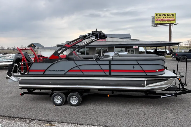 Slide: The Image of 2026 Berkshire 25SB2 STS pontoon boat on trailer at dealership lot. - 6