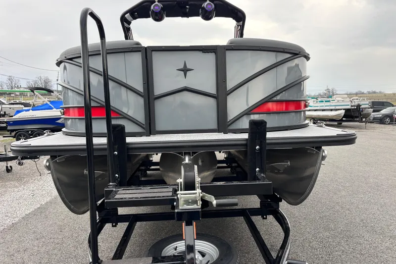 Slide: The Image of 2026 Berkshire 25SB2 STS pontoon boat on trailer, rear view in a marina setting. - 7