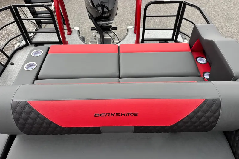 Slide: The Image of 2026 Berkshire 25SB2 STS boat interior with red and gray seating, cup holders. - 9