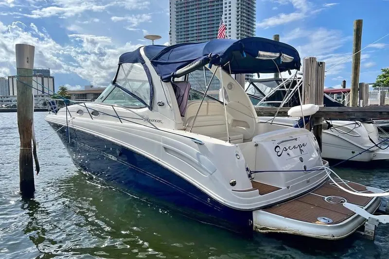 The Image of 2005 Sea Ray 300 Sundancer docked near urban waterfront buildings. - 0