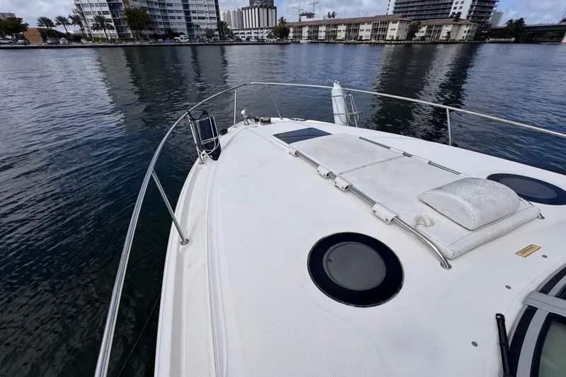 Slide: The Image of 2005 Sea Ray 300 Sundancer boat deck with cityscape background. - 40