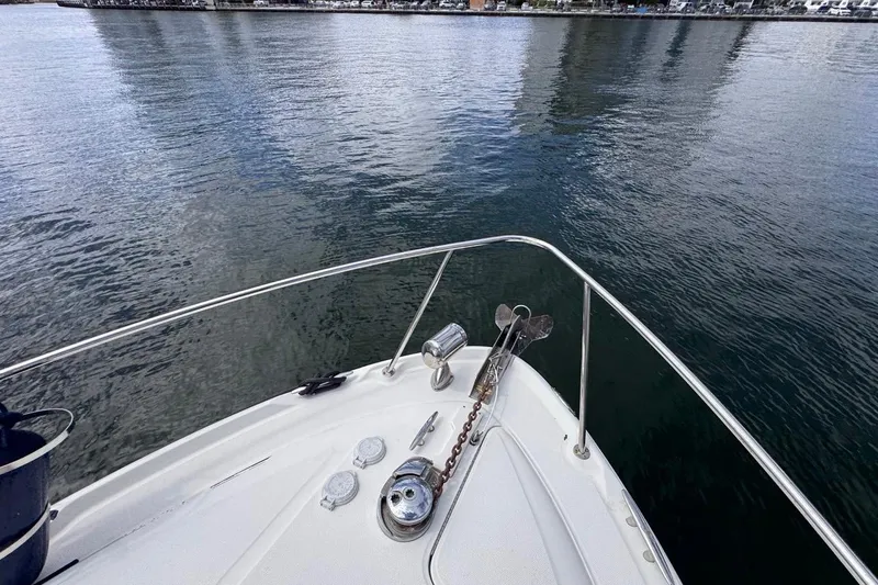 Slide: The Image of Bow view of 2005 Sea Ray 300 Sundancer on calm water. - 47