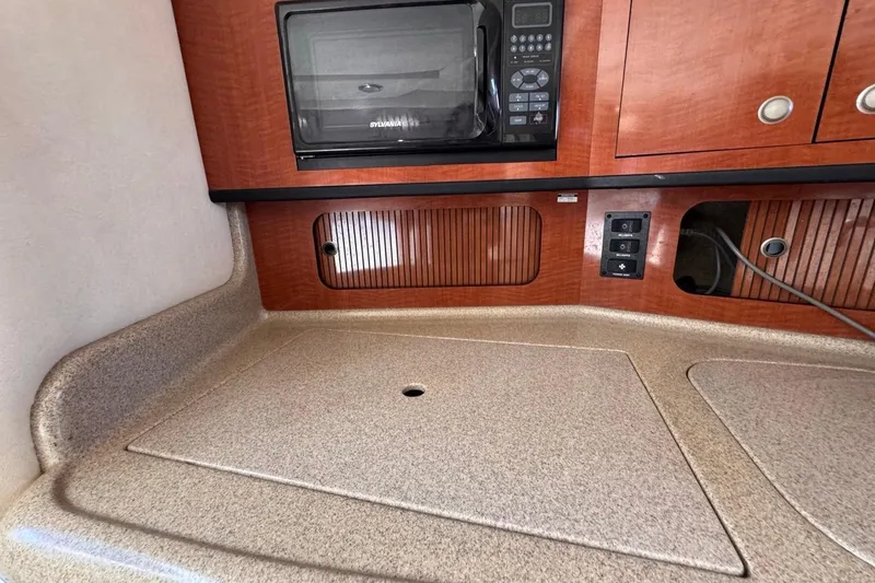 Slide: The Image of Interior of 2005 Sea Ray 300 Sundancer with microwave and countertop. - 65