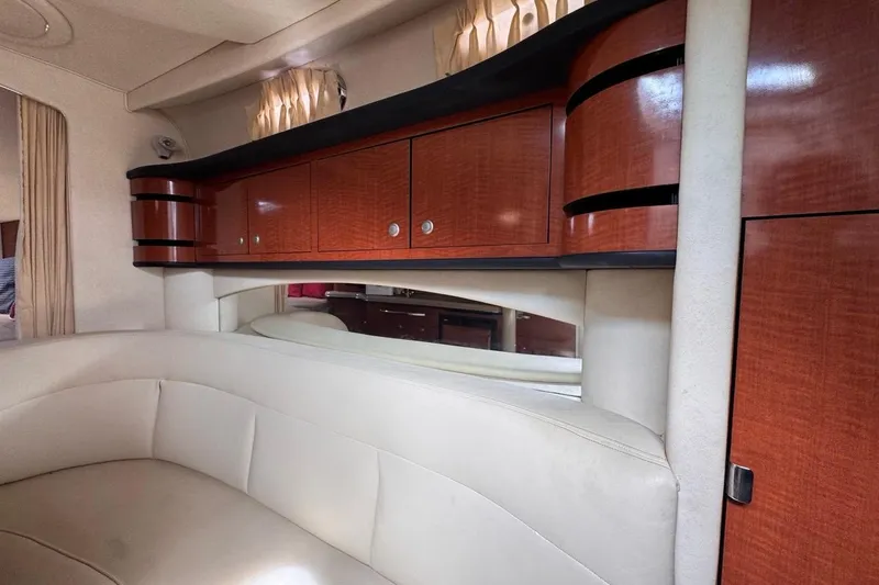 Slide: The Image of Luxurious interior of 2005 Sea Ray 300 Sundancer with elegant wood cabinetry and plush seating. - 72
