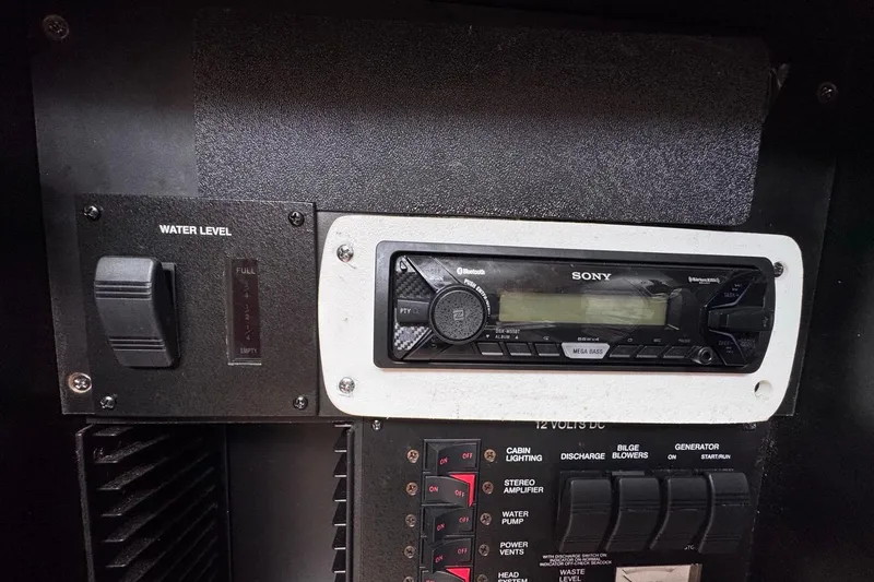 Slide: The Image of Control panel of a 2005 Sea Ray 300 Sundancer with Sony stereo system. - 79