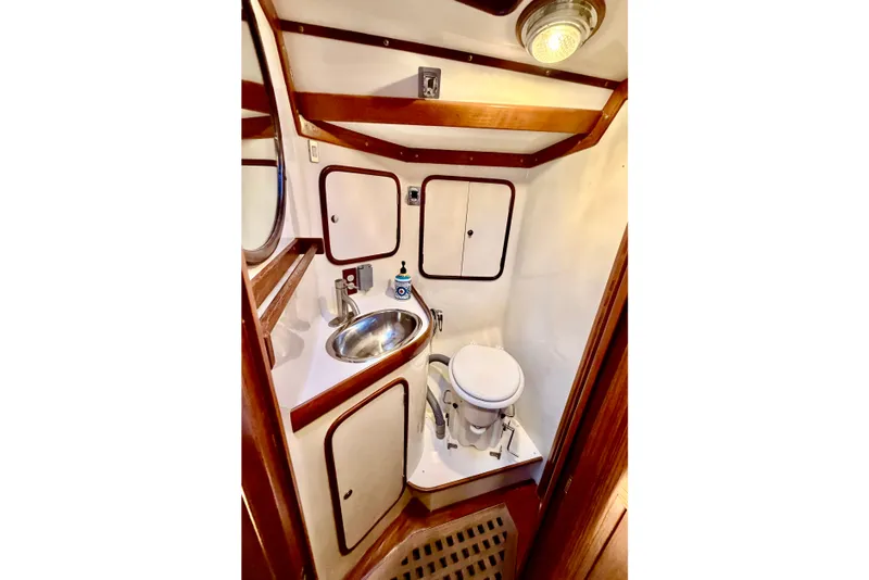 Slide: The Image of Compact bathroom in 2001 Tayana Vancouver 42 yacht with sink and toilet. - 14
