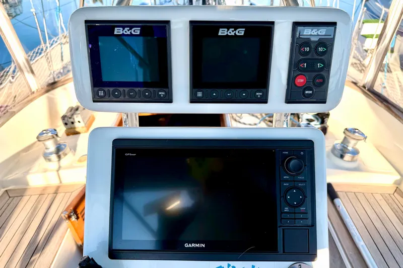 Slide: The Image of Navigation equipment on 2001 Tayana Vancouver 42 sailboat, featuring B&G and Garmin displays. - 18