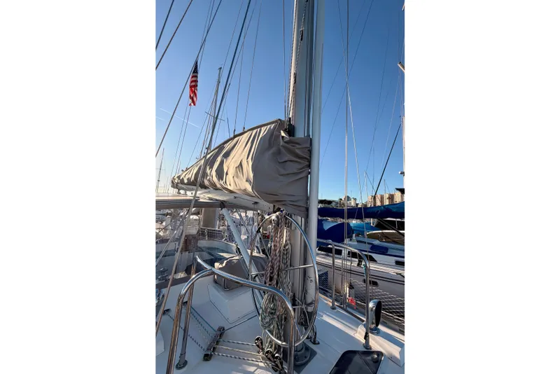 Slide: The Image of Sailboat Tayana Vancouver 42, 2001 model, docked with mast and rigging visible. - 20