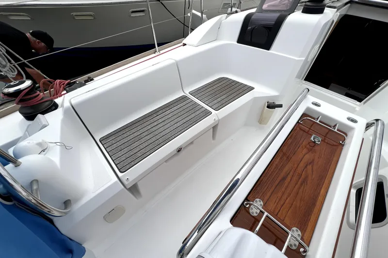 Slide: The Image of Cockpit of 2014 Jeanneau Sun Odyssey 379 sailboat with seating and steering wheel. - 12