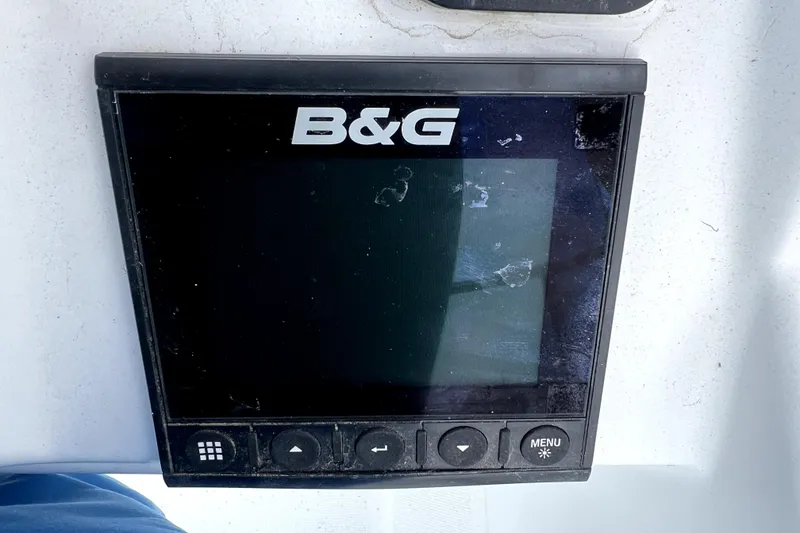 Slide: The Image of 2014 Jeanneau Sun Odyssey 379 sailboat being lifted at a marina. - 24