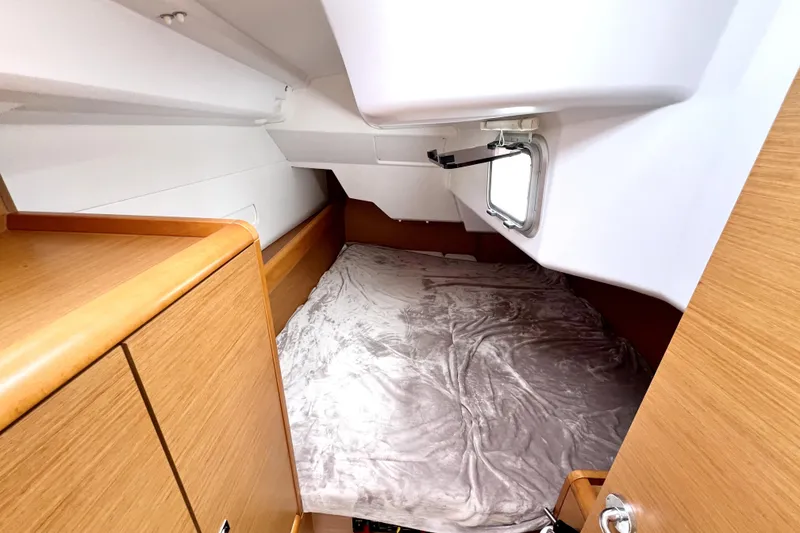 Slide: The Image of Interior of 2014 Jeanneau Sun Odyssey 379 yacht with modern kitchen and cozy cabin. - 41