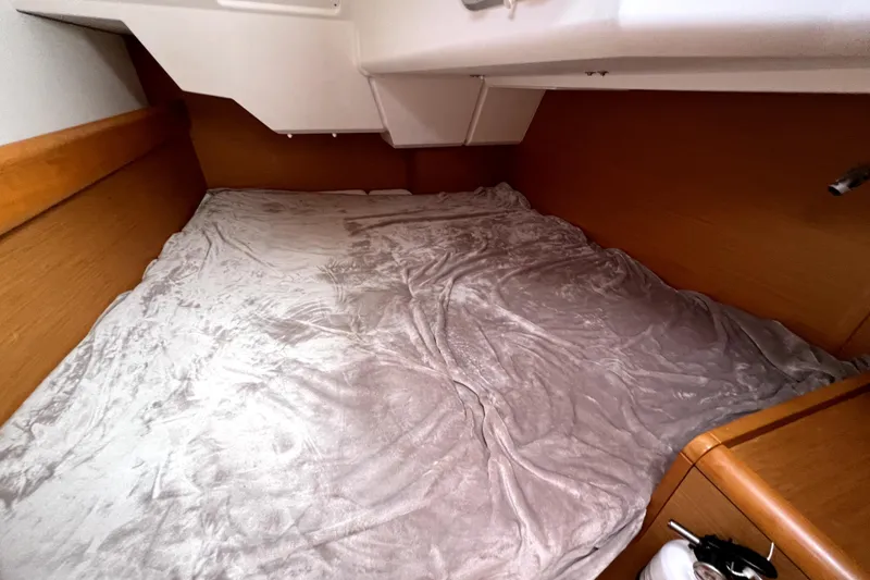 Slide: The Image of Interior of 2014 Jeanneau Sun Odyssey 379 sailboat, featuring cabin and wooden stairs. - 42