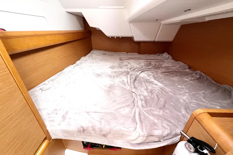 Slide: The Image of Cozy cabin interior of 2014 Jeanneau Sun Odyssey 379 sailboat with comfortable bedding. - 44