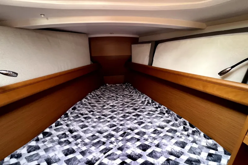 Slide: The Image of Cozy cabin interior of 2014 Jeanneau Sun Odyssey 379 sailboat with bed and storage. - 46