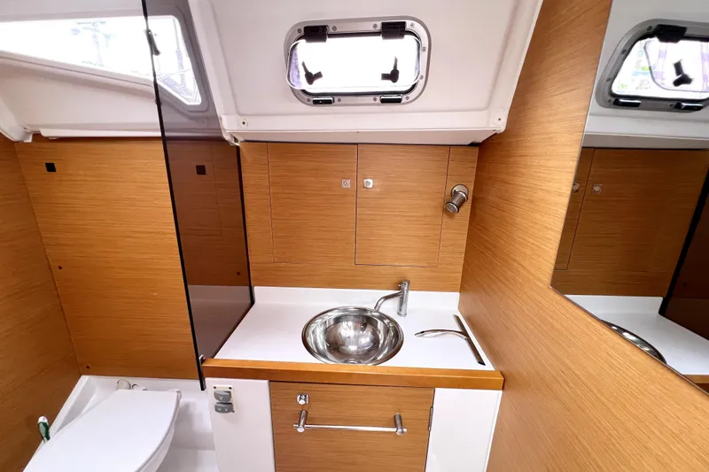 Slide: The Image of Cozy cabin interior of 2014 Jeanneau Sun Odyssey 379 sailboat with comfortable bedding. - 49