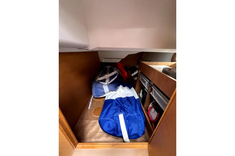 Slide: The Image of Bathroom interior of 2014 Jeanneau Sun Odyssey 379 yacht, featuring modern fixtures and wood paneling. - 52