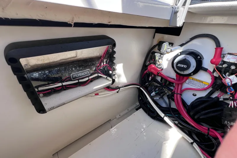 Slide: The Image of 2021 Sea Ray SDX 270 Outboard electrical system with Fusion amplifier and wiring. - 24