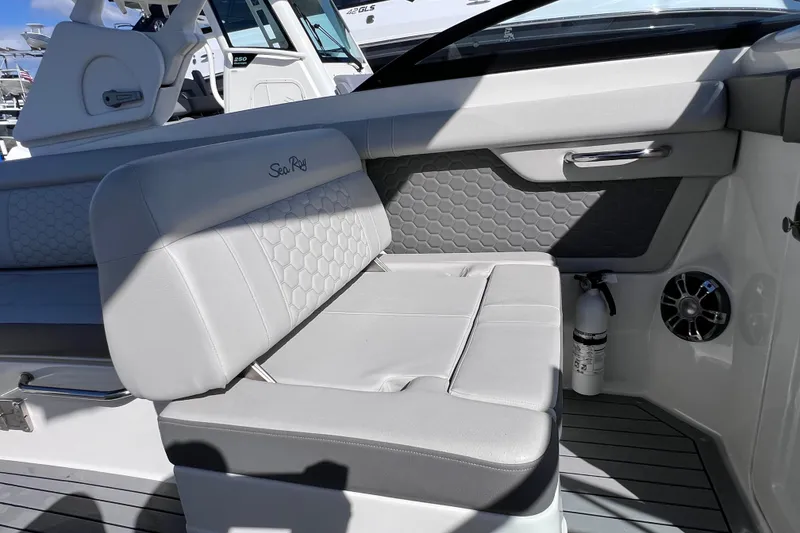 Slide: The Image of 2021 Sea Ray SDX 270 Outboard interior with gray seating and modern design elements. - 25