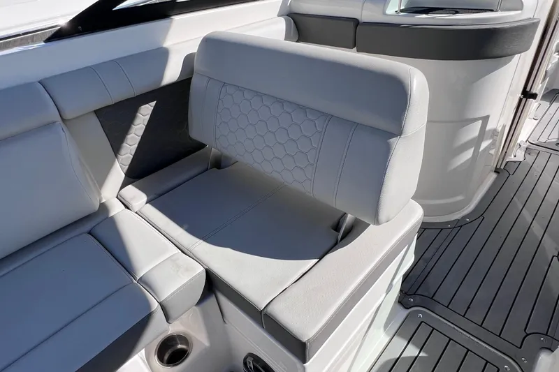 Slide: The Image of 2021 Sea Ray SDX 270 Outboard boat interior with gray cushioned seating. - 26