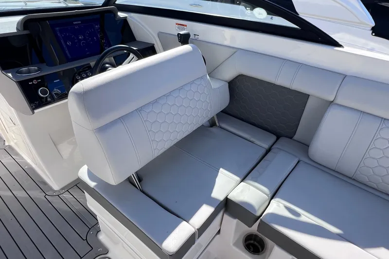 Slide: The Image of 2021 Sea Ray SDX 270 Outboard interior with luxurious seating and modern dashboard. - 27