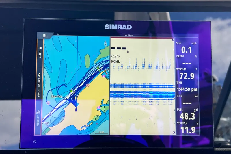 Slide: The Image of Simrad navigation display on 2021 Sea Ray SDX 270 Outboard, showing map and sonar data. - 31