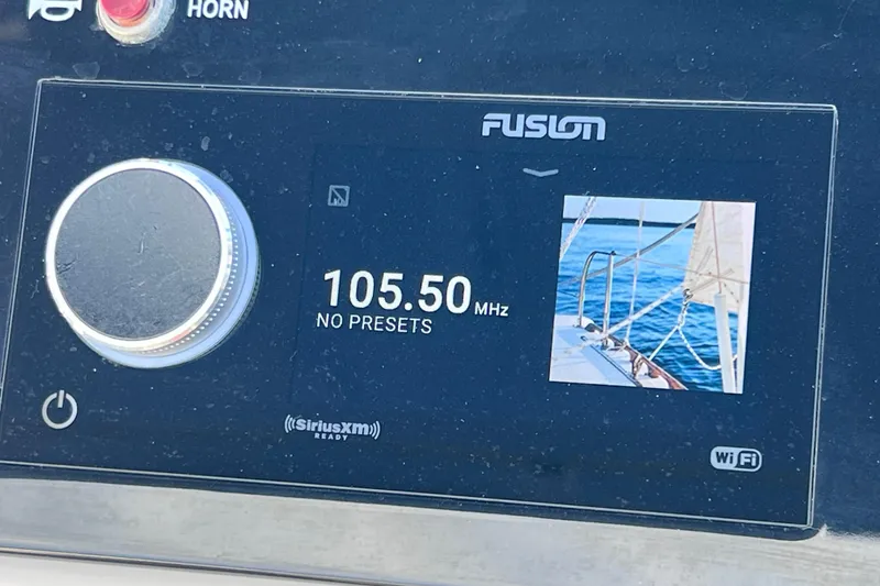 Slide: The Image of Fusion marine radio display on 2021 Sea Ray SDX 270 Outboard, tuned to 105.50 MHz. - 36
