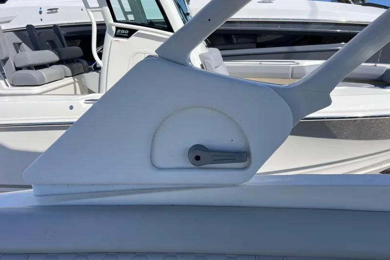 Slide: The Image of 2021 Sea Ray SDX 270 Outboard boat interior detail with seating and control panel. - 41