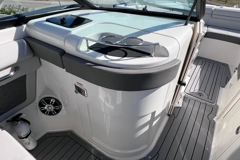 Slide: The Image of 2021 Sea Ray SDX 270 Outboard interior with cup holders and sleek design. - 42