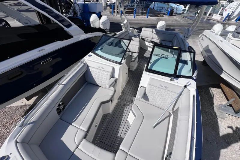 Slide: The Image of 2021 Sea Ray SDX 270 Outboard boat interior with spacious seating and modern design. - 46