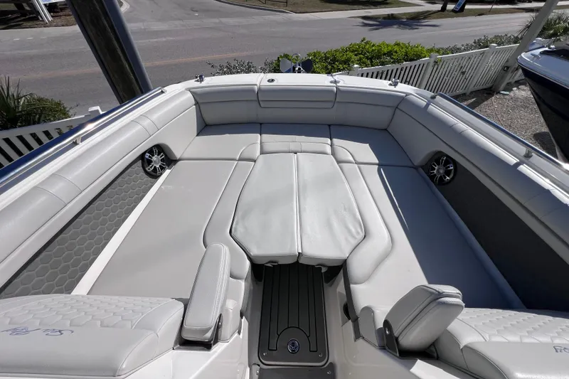 Slide: The Image of 2021 Sea Ray SDX 270 Outboard boat interior with spacious seating and modern design. - 47