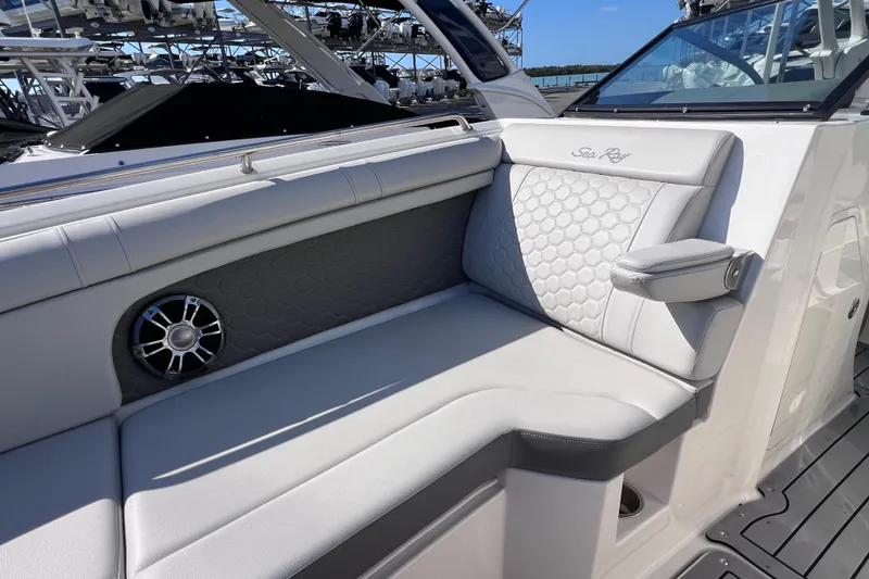 Slide: The Image of 2021 Sea Ray SDX 270 Outboard boat interior with luxurious seating and speaker. - 49