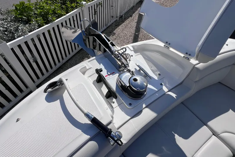 Slide: The Image of 2021 Sea Ray SDX 270 Outboard boat anchor compartment with sleek design and modern features. - 52