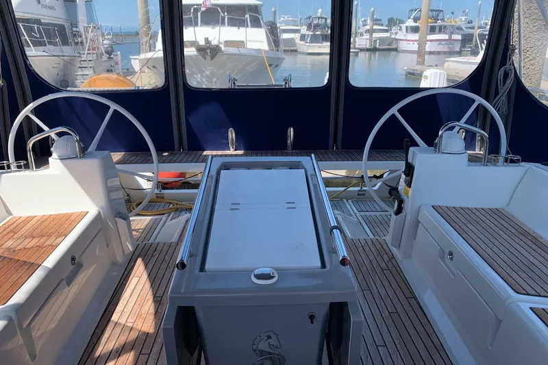 Slide: The Image of Cockpit of 2018 Beneteau Oceanis 45 yacht with dual steering wheels in marina. - 17