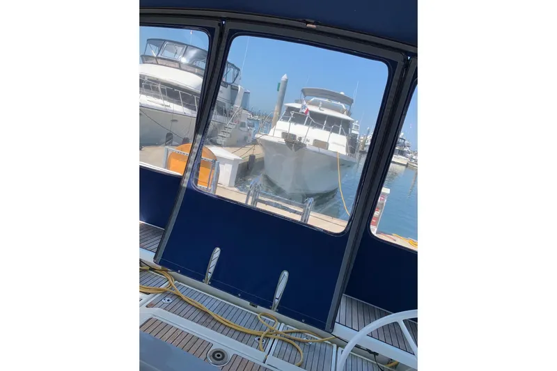 Slide: The Image of View from Beneteau Oceanis 45, 2018 model, overlooking docked boats in marina. - 18