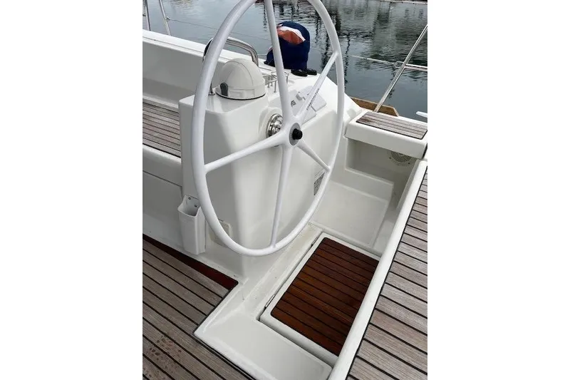 Slide: The Image of Steering wheel of 2018 Beneteau Oceanis 45 yacht with wooden deck details. - 22