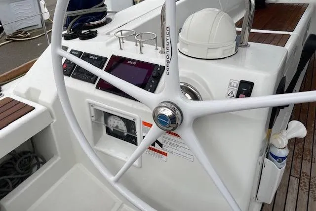 Slide: The Image of Steering wheel and controls of a 2018 Beneteau Oceanis 45 sailboat. - 23