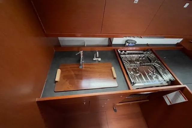 Slide: The Image of Galley kitchen in 2018 Beneteau Oceanis 45 yacht with stove and sink. - 33