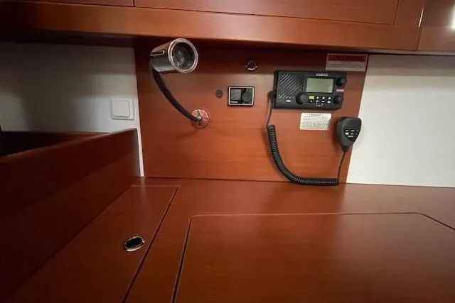 Slide: The Image of Interior of 2018 Beneteau Oceanis 45 yacht with radio and wood finish. - 36